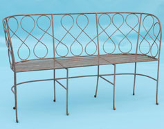 Bench with swirly detail on back and slatted seat base